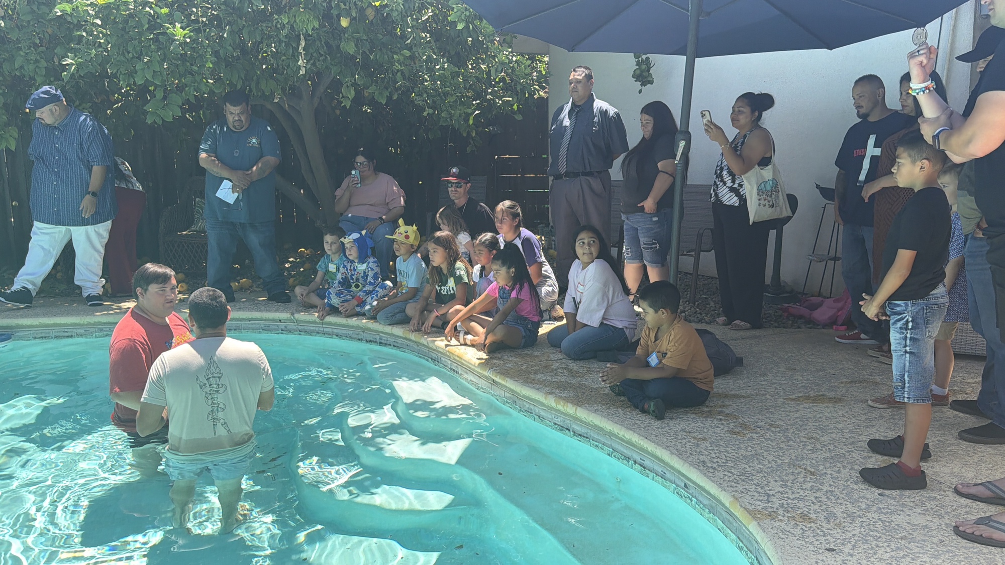 The Mosaic Church family gathered around a baptism